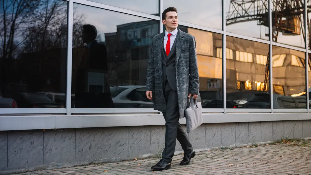 Bespoke suit professional walking through London's financial district